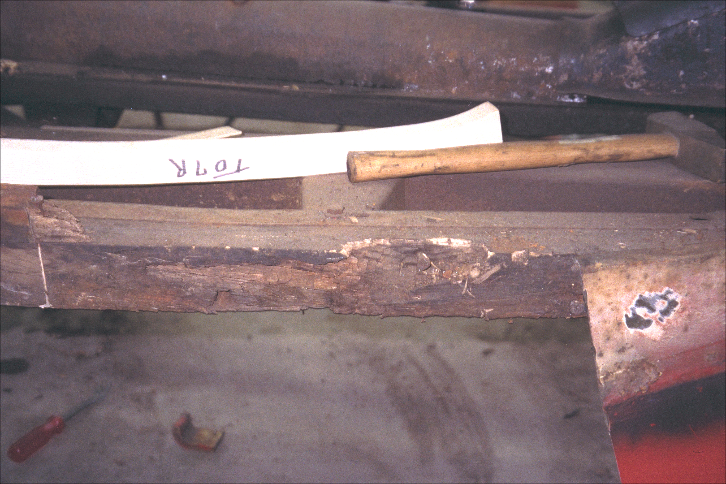 Rot in right wood framing near door sill